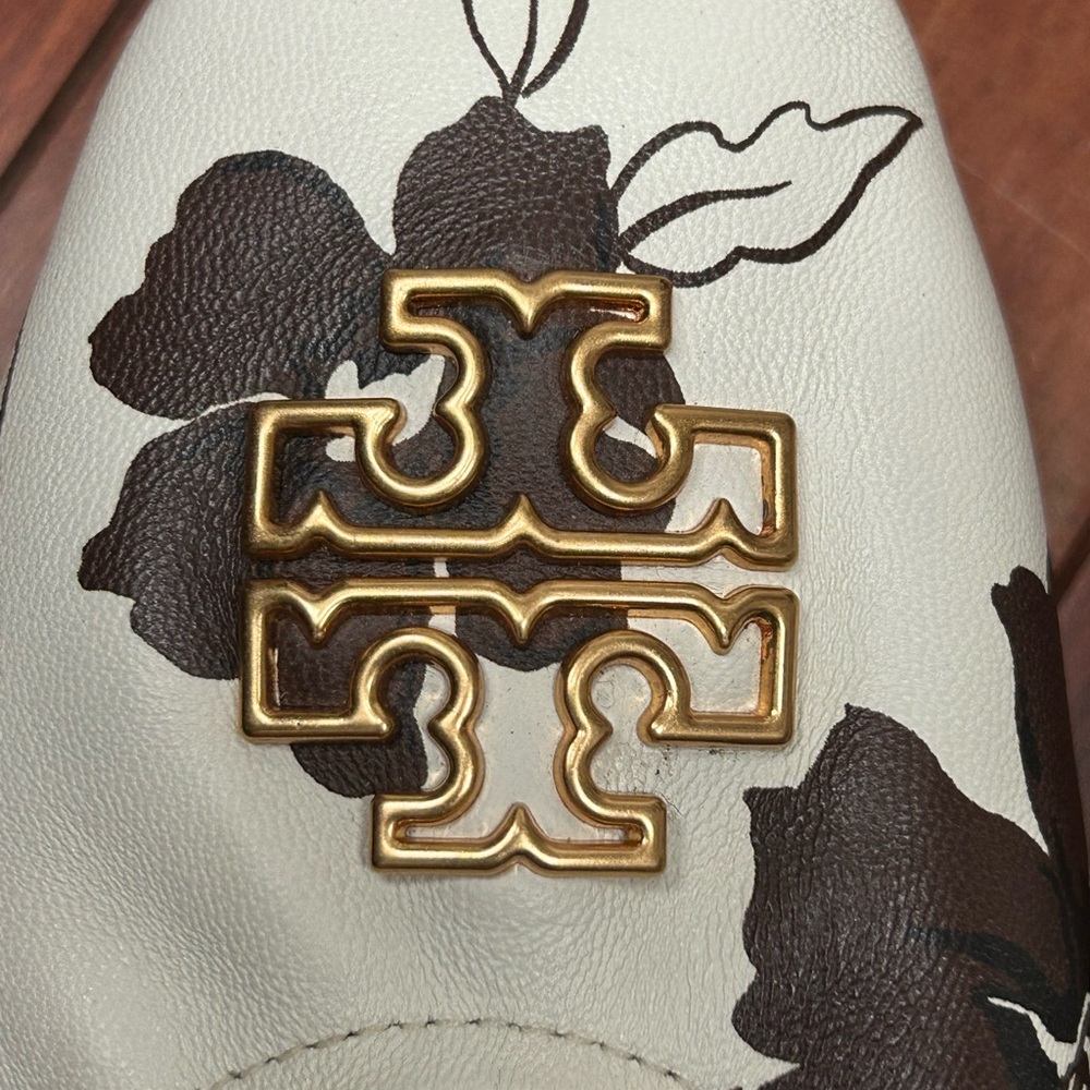Tory Burch Cream Flats with Brown Floral and Gold Emblem